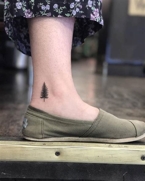 The tree design is simple but stunning, and the placement on the ankle. . Ankle tree tattoo